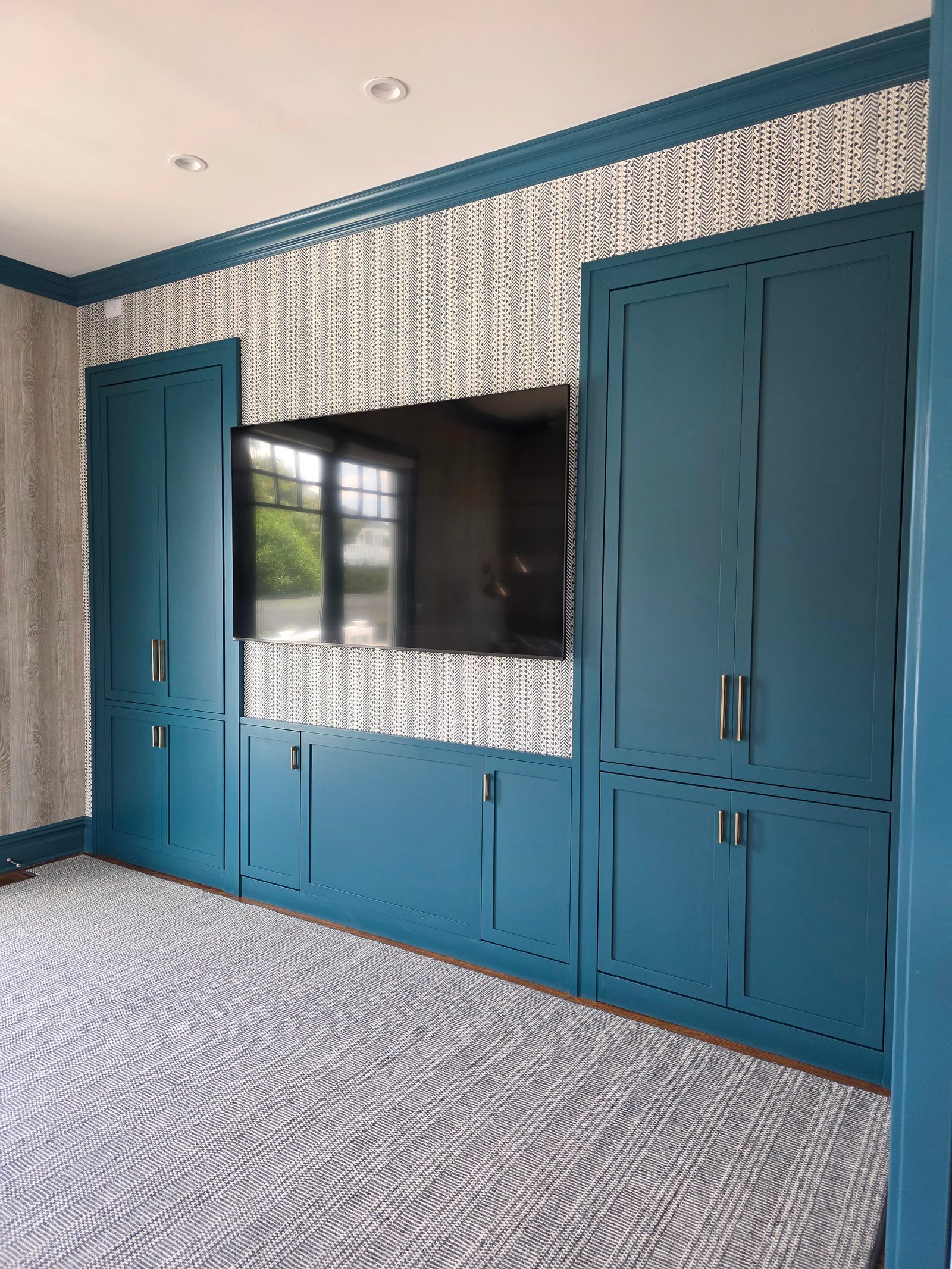 Custom built-in bookcase wall painted white, built and installed in Pennsylvania