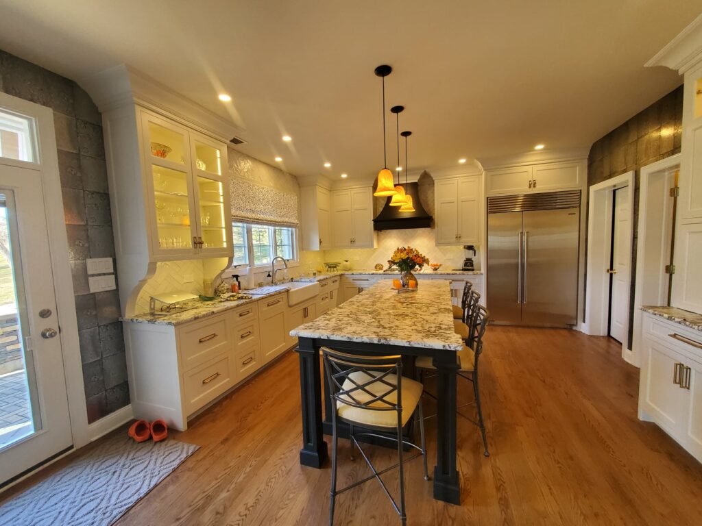 Elegant custom kitchen in New Hope, PA with inset cabinets, granite countertops, and hardwood flooring.