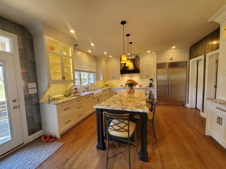 Elegant custom kitchen in New Hope, PA with inset cabinets, granite countertops, and hardwood flooring.