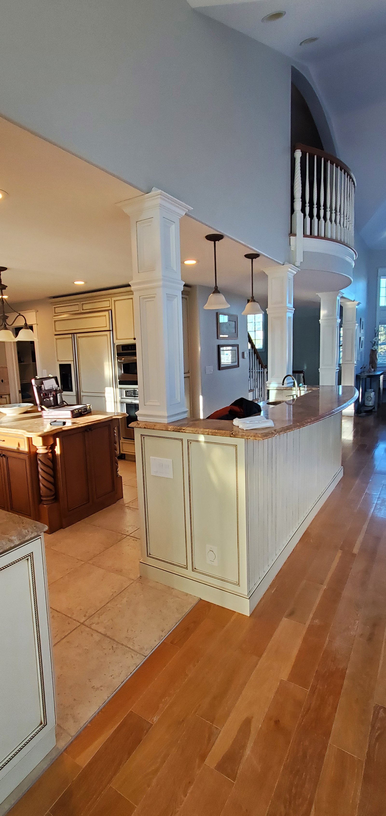 White custom coastal kitchen with blue tile backsplash in Avalon New Jersey