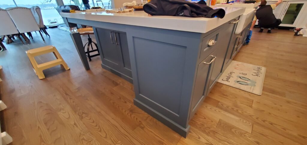 Custom blue kitchen island with cabinetry and drawers, perfect for modern kitchen renovation.