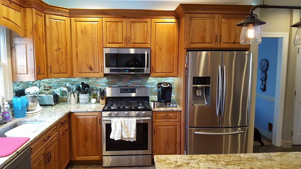 Handcrafted Amish kitchen design featuring Rustic Cherry wood cabinetry
