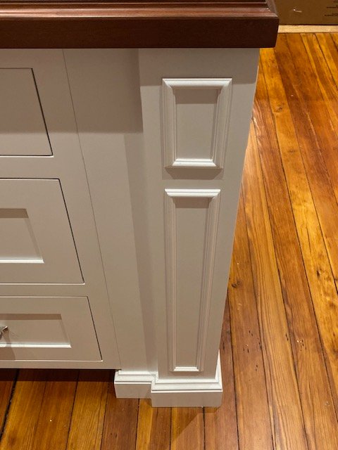 White shaker kitchen cabinets with marble countertops, custom built