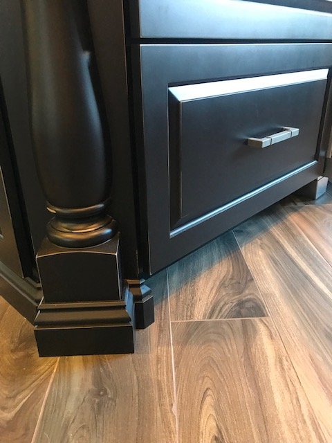 Custom kitchen storage detail with solid wood drawers