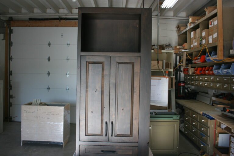Custom dark wood cabinet with open upper shelving for kitchen or home storage.