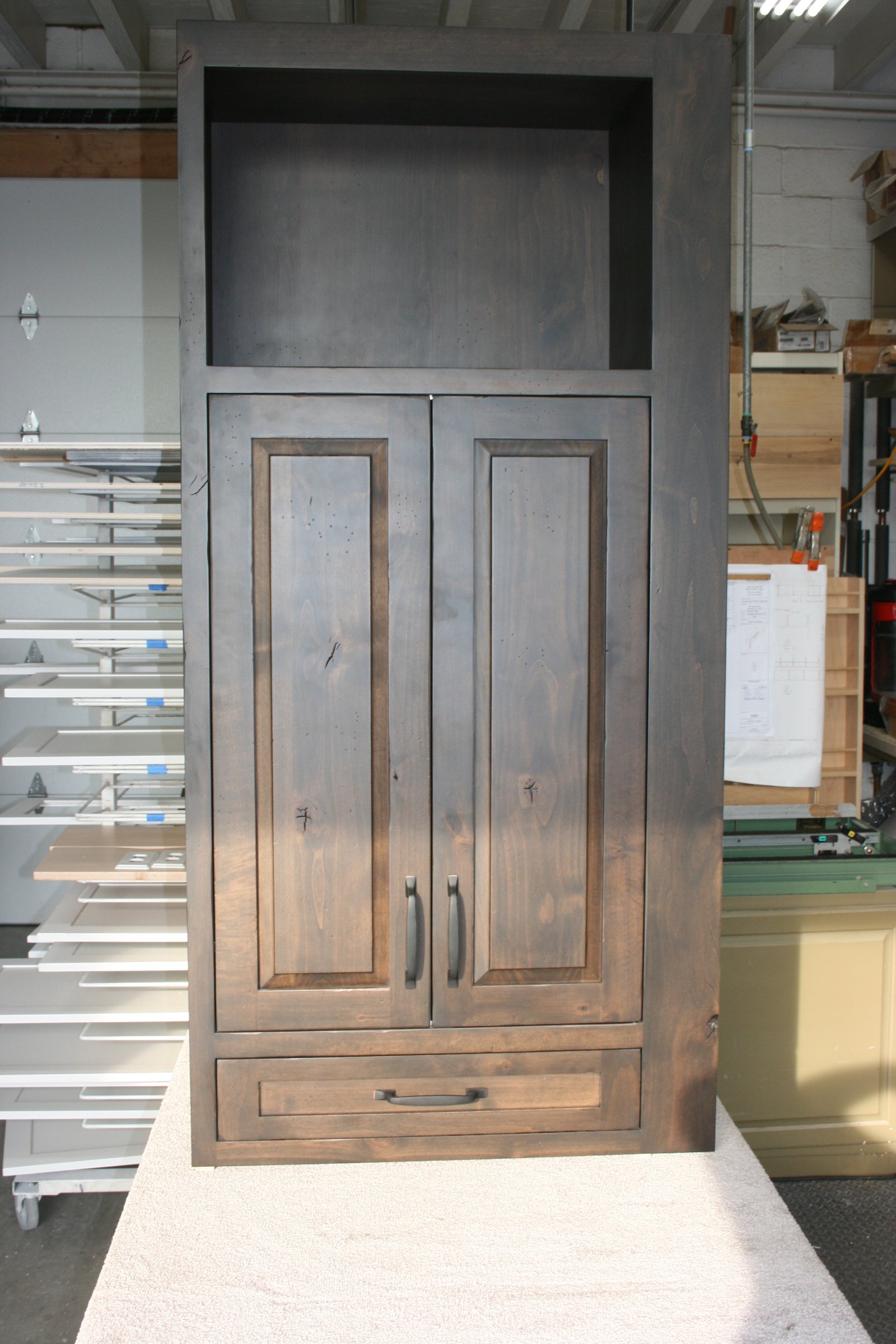 Dark walnut home bar cabinetry with open shelving and storage, PA