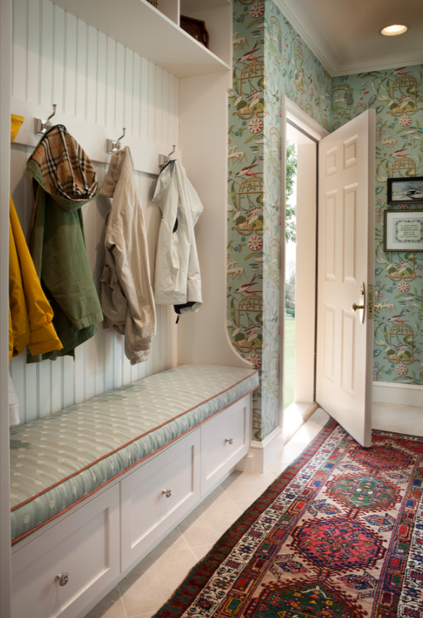 Custom mudroom entryway with built-in white cabinetry, upholstered bench, and storage drawers by Choice Custom Cabinetry & Design in Pennsylvania.”