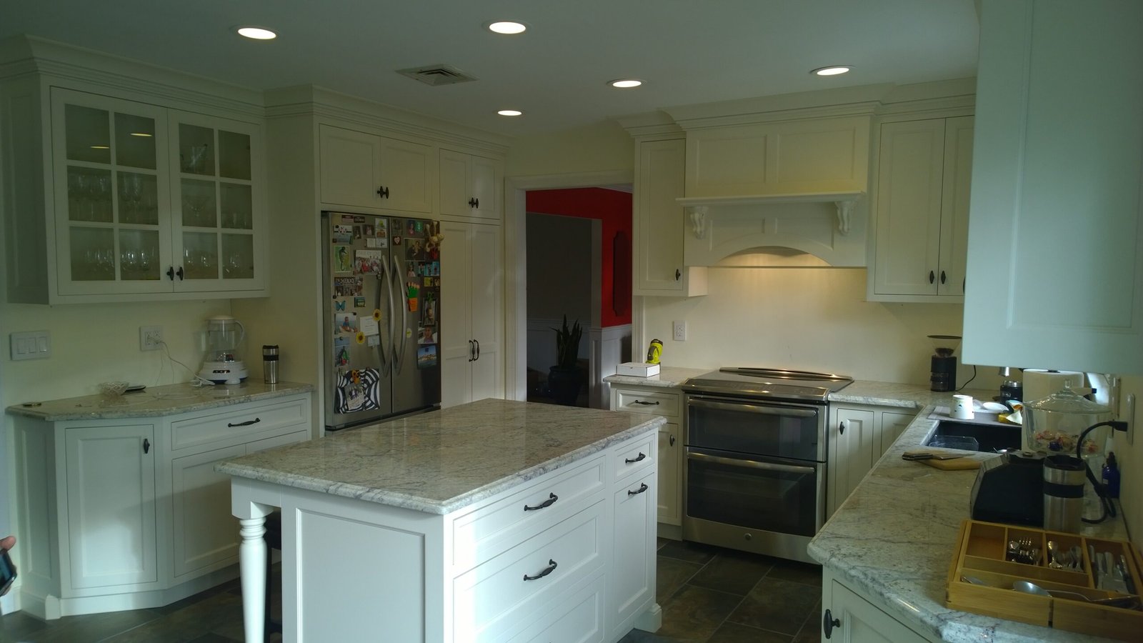 classic custom kitchen layout with island and built-in appliances