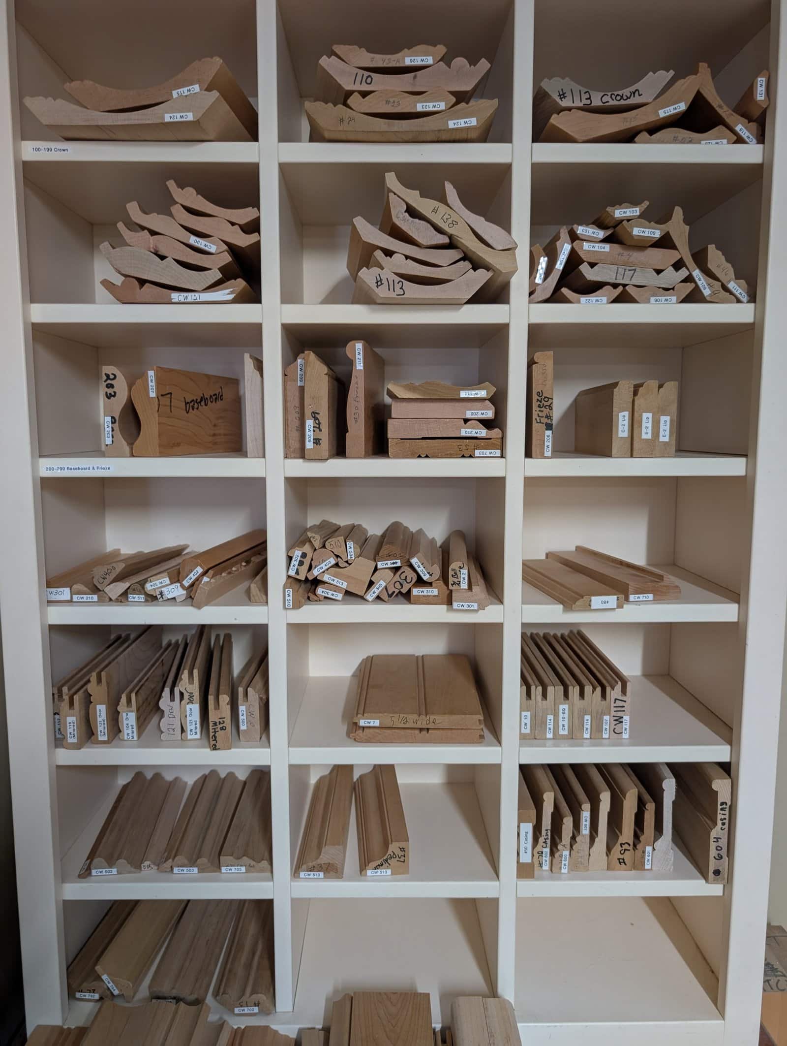 Walnut and white oak crown molding profiles milled by Choice Custom Cabinetry