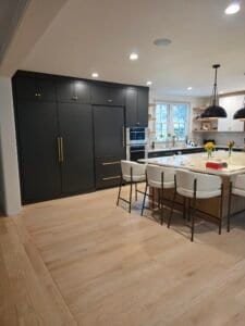 Modern kitchen with dark cabinetry.