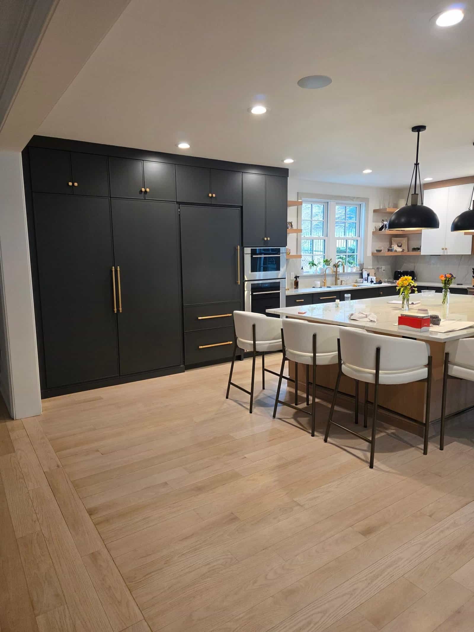 Modern kitchen with dark cabinetry.