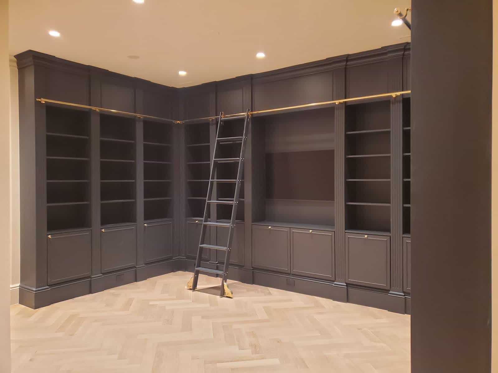 Custom built-in office cabinetry detail with raised panel lowers